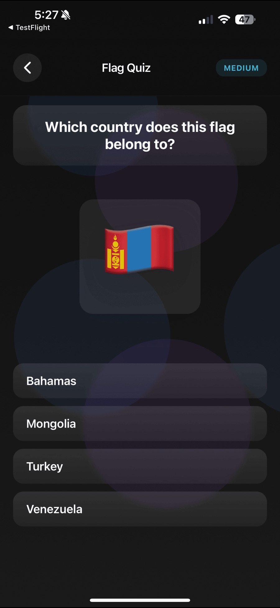 A Medium-difficulty Flag Quiz question asking "Which country does this flag belong to?" above Mongolia's red-and-blue flag, with four tappable answers: Bahamas, Mongolia, Turkey and Venezuela.