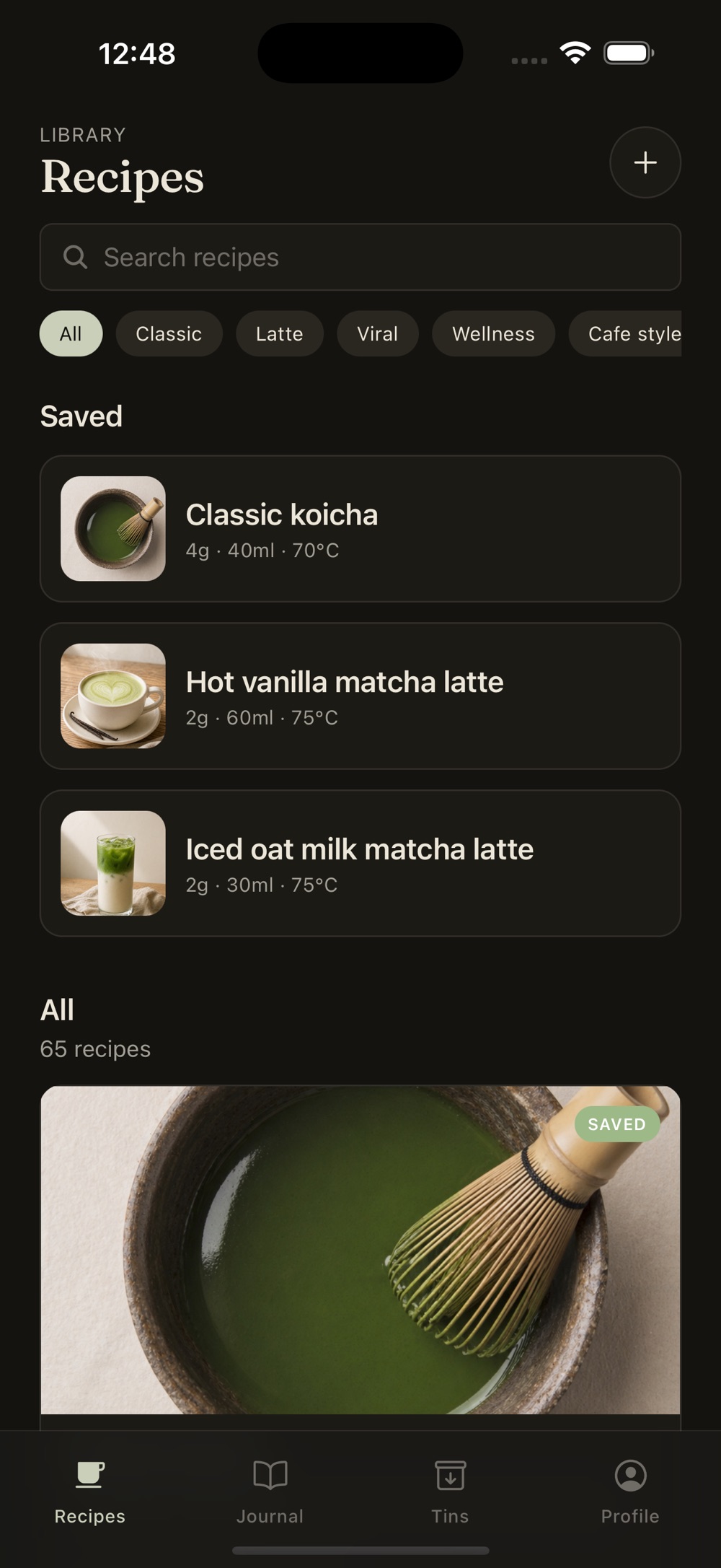 Matcha Almanac recipe library with a search field and category filters for classic, latte, viral, wellness and cafe style. Saved recipes list Classic koicha at 4g, 40ml, 70°C, Hot vanilla matcha latte at 2g, 60ml, 75°C, and Iced oat milk matcha latte at 2g, 30ml, 75°C, above an All section of 65 recipes.